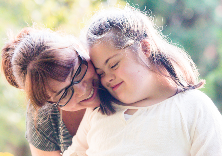 A caretaker sharing a moment of connection with the person they support