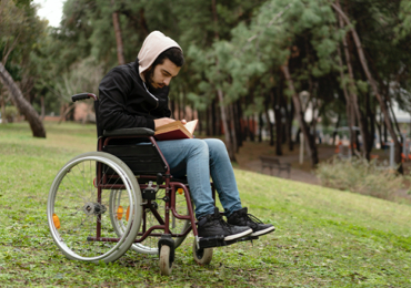 A person living with a disability enjoying an outdoor activity
